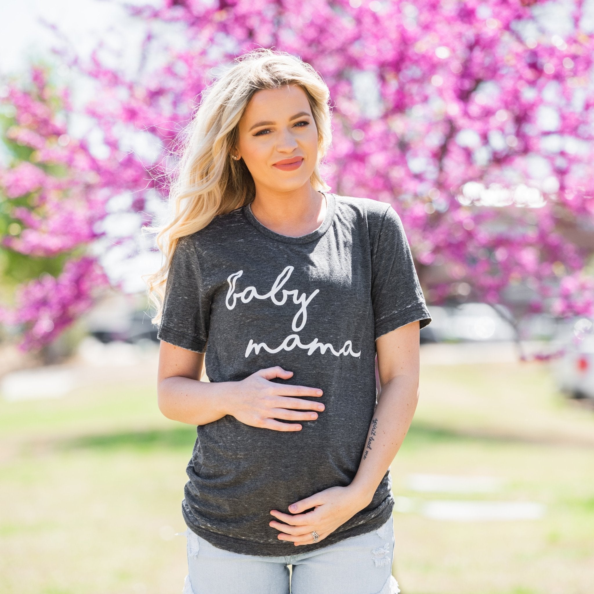 Mom Tees | Lush Fashion Lounge: mom life t shirts, mommy graphic tees, cute graphic tees for moms, cute t shirts for moms, trendy womens boutiques online, cute online womens boutiques. Pregnant model holds belly wearing graphic t-shirt that says baby mama