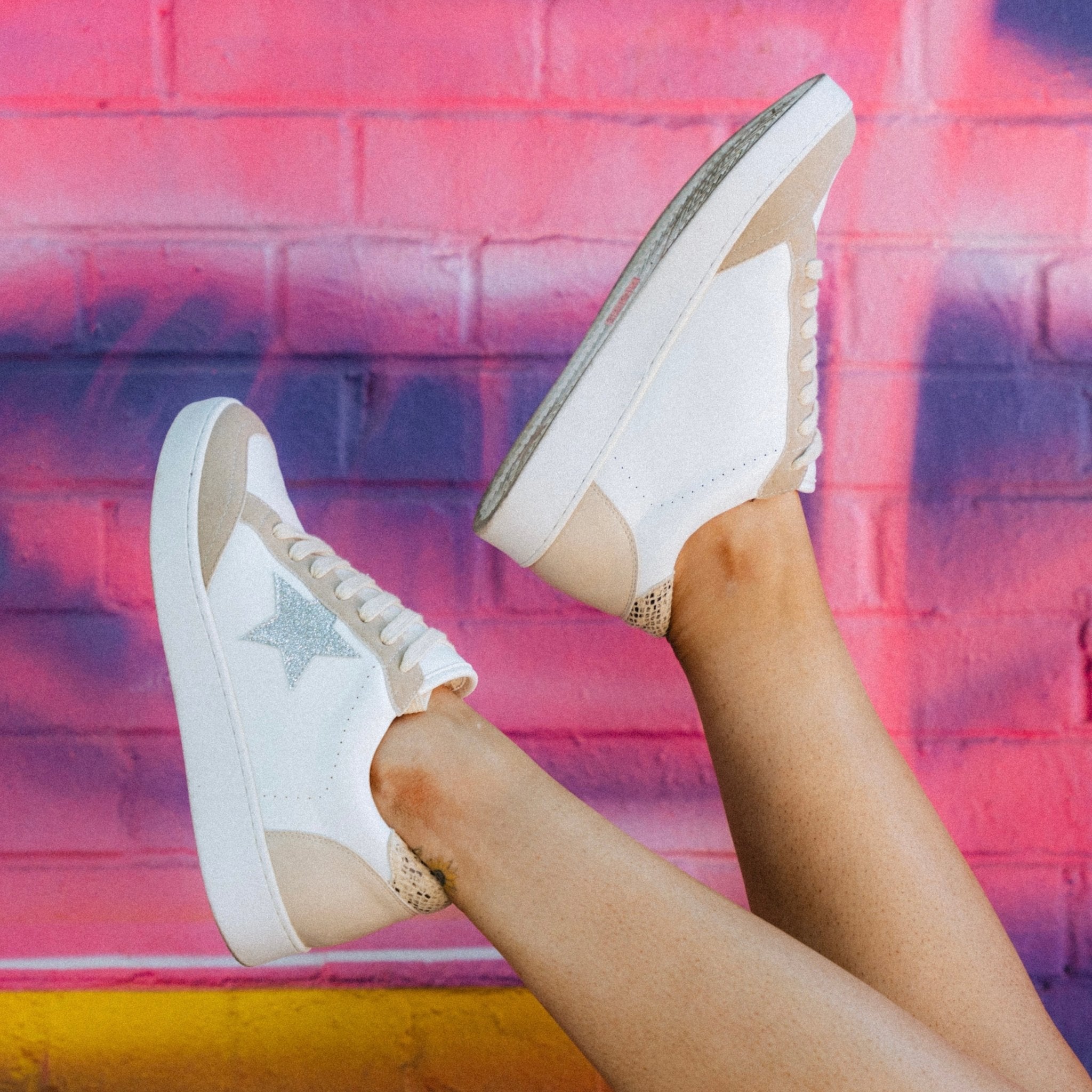 Star sneakers against a colorful fun wall from Lush Fashion Lounge women's boutique in Oklahoma City 