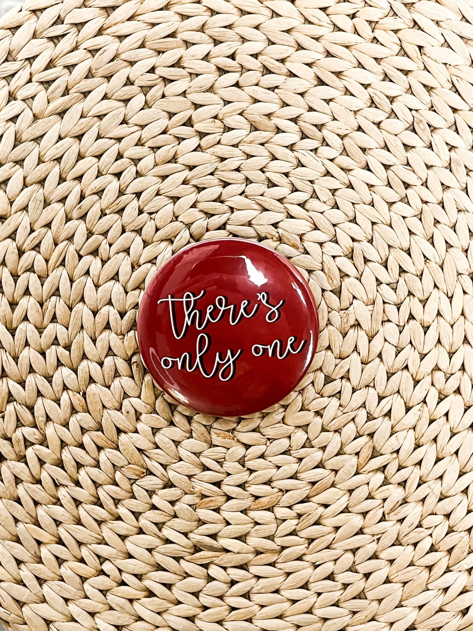 There's only one 2.25 inch game day button crimson