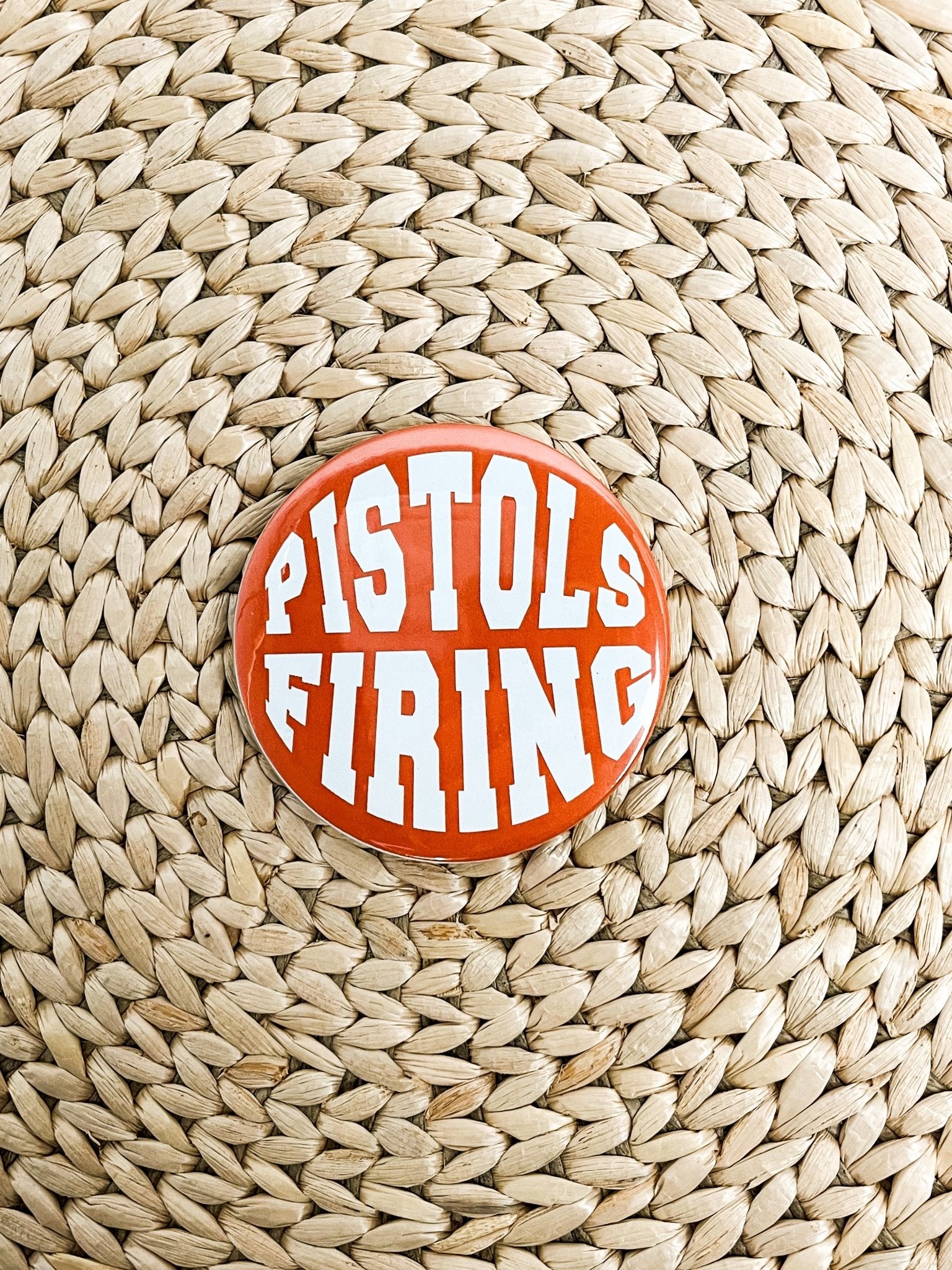 Pistols Firing 2.25 inch game day button orange
