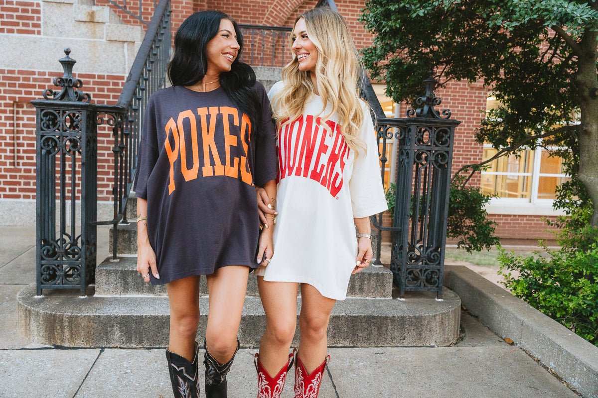 OSU Pokes oversized charcoal t-shirt with orange letters and Sooners oversized cream t-shirt in red letters from Lush Fashion Lounge boutique. Cute trendy OU and OSU apparel 