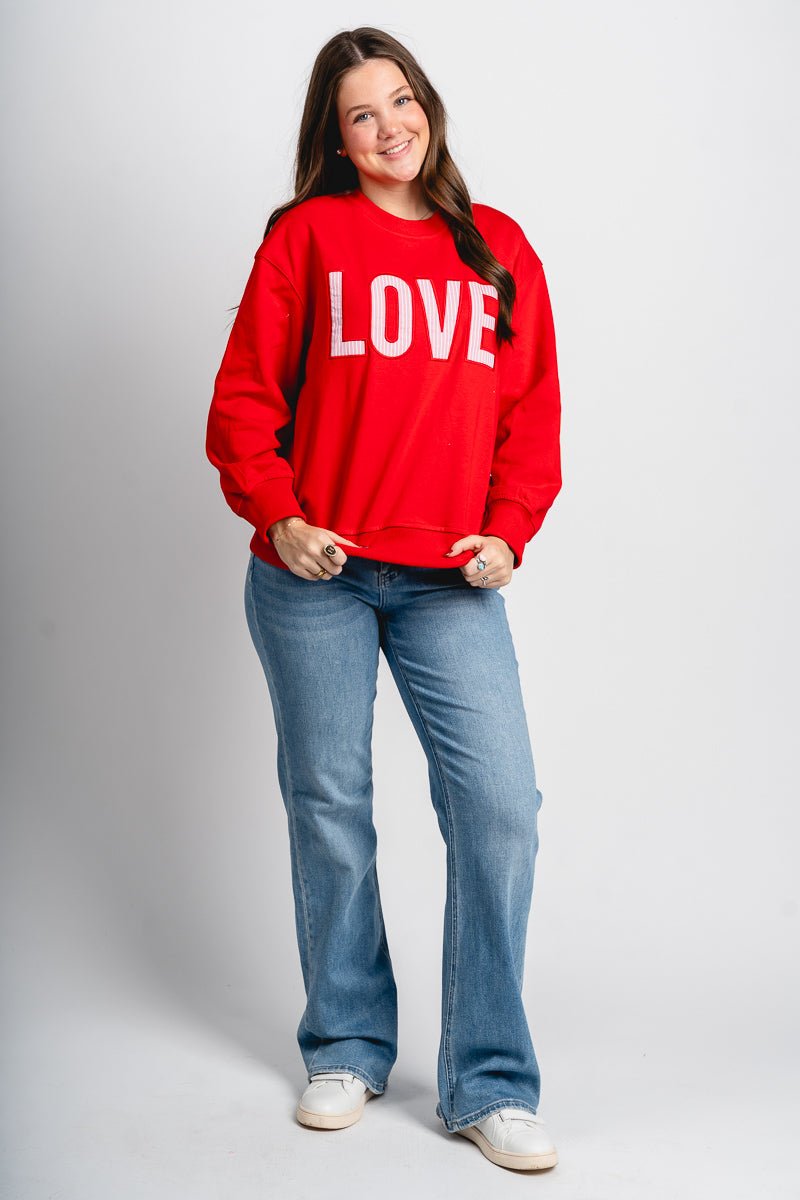 LOVE patch sweatshirt red - Cute Valentine's Day Outfits at Lush Fashion Lounge Boutique in Oklahoma City