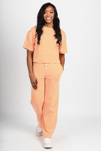 Striped wide leg pants orange/white - Oklahoma City inspired graphic t-shirts at Lush Fashion Lounge Boutique in Oklahoma City