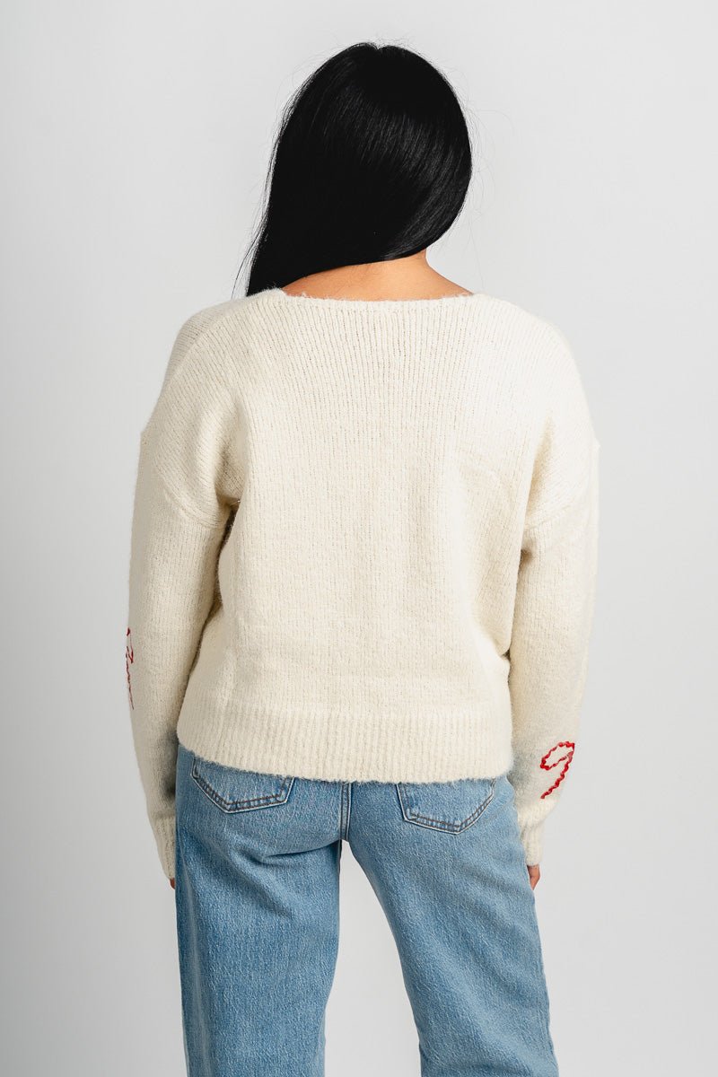 Bow detail sweater cream/red