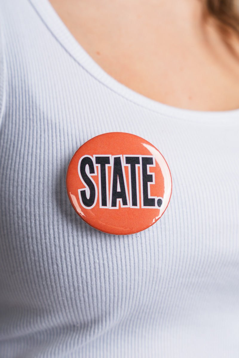 OSU OSU STATE. 2.25 inch button button Orange | Lush Fashion Lounge Trendy Oklahoma State Cowboys Apparel & Cute Gameday T-Shirts