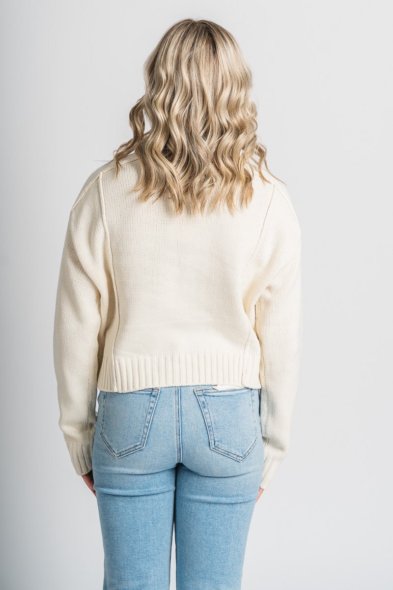 Reverse seam sweater cream