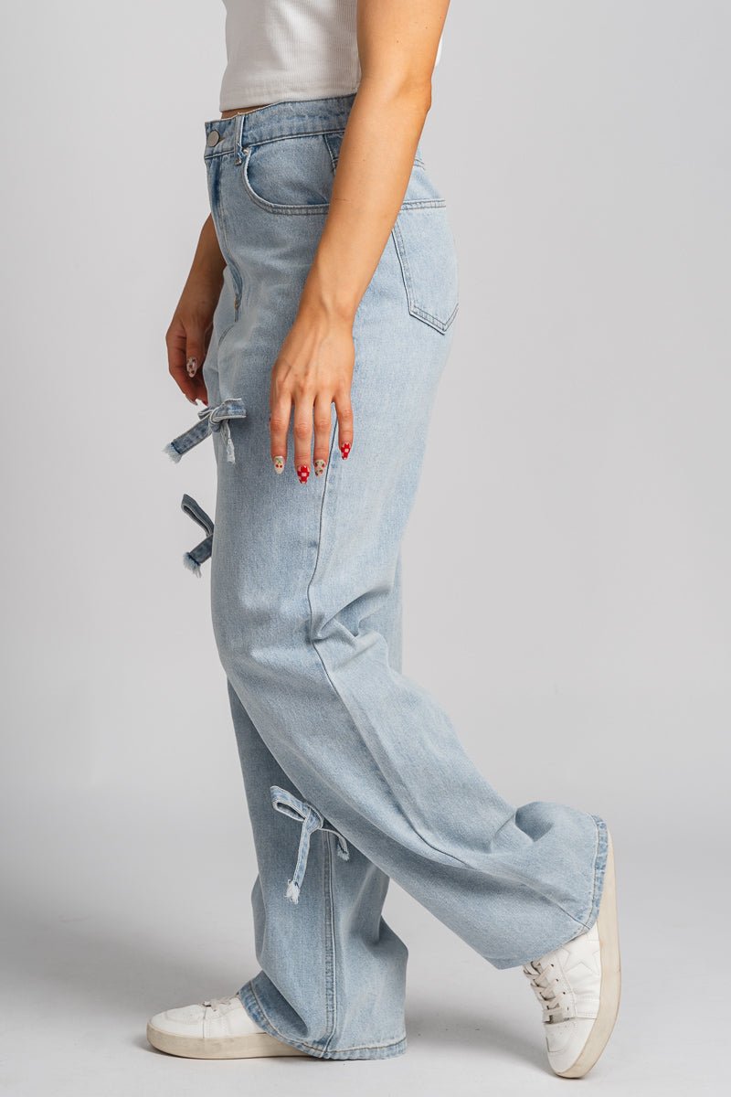 Bow detail wide leg jeans light denim | Lush Fashion Lounge: boutique women's jeans, fashion jeans for women, affordable fashion jeans, cute boutique jeans