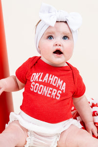 OU Kids OU Sooner classic arch onesie red Onesie | Lush Fashion Lounge Trendy Oklahoma University Sooners Apparel & Cute Gameday T-Shirts